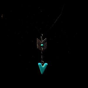 Arrow with black necklace